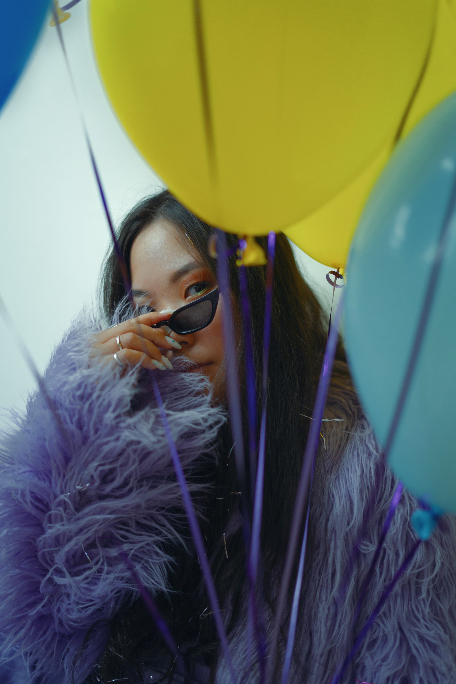 Editorial portrait framed by balloons