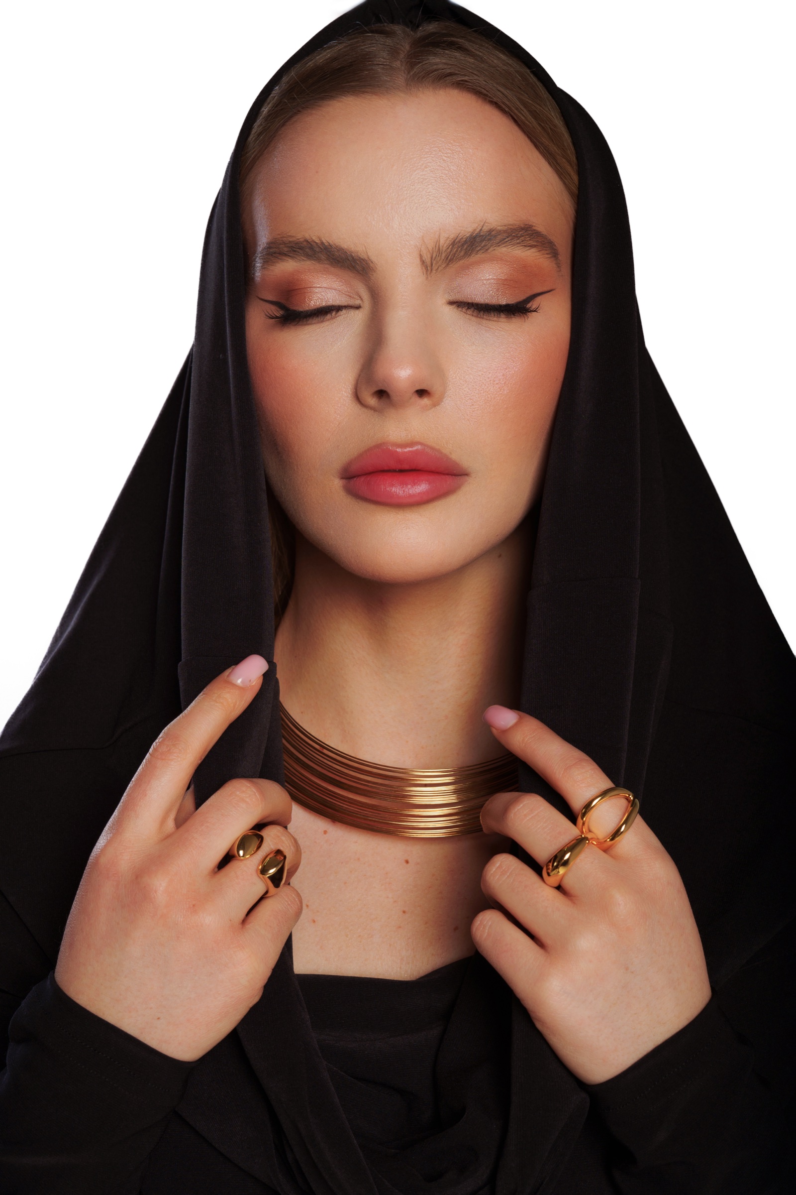 Portrait in black with gold jewelry